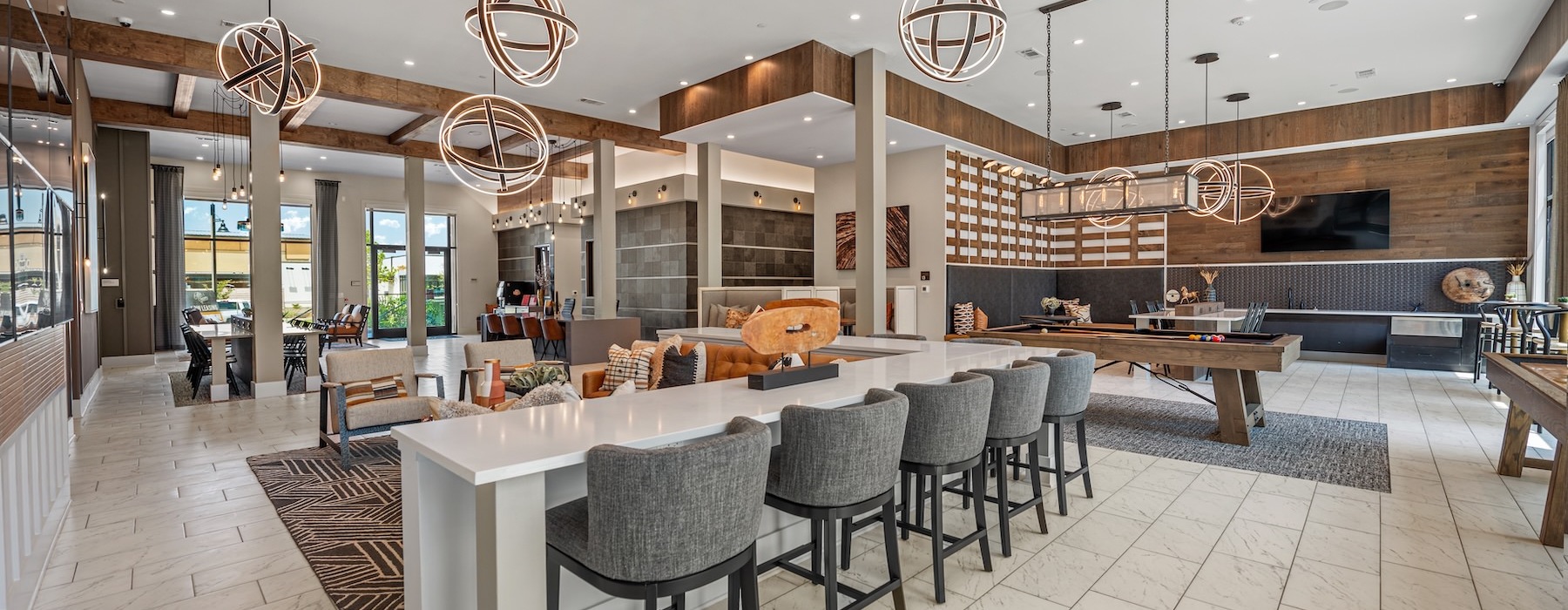 a clubhouse room with tables and chairs
