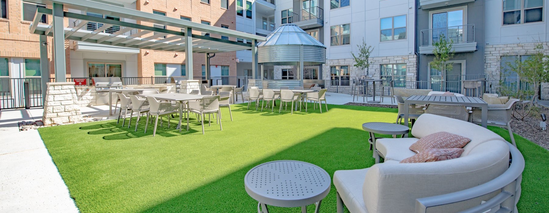 a courtyard with tables and chairs