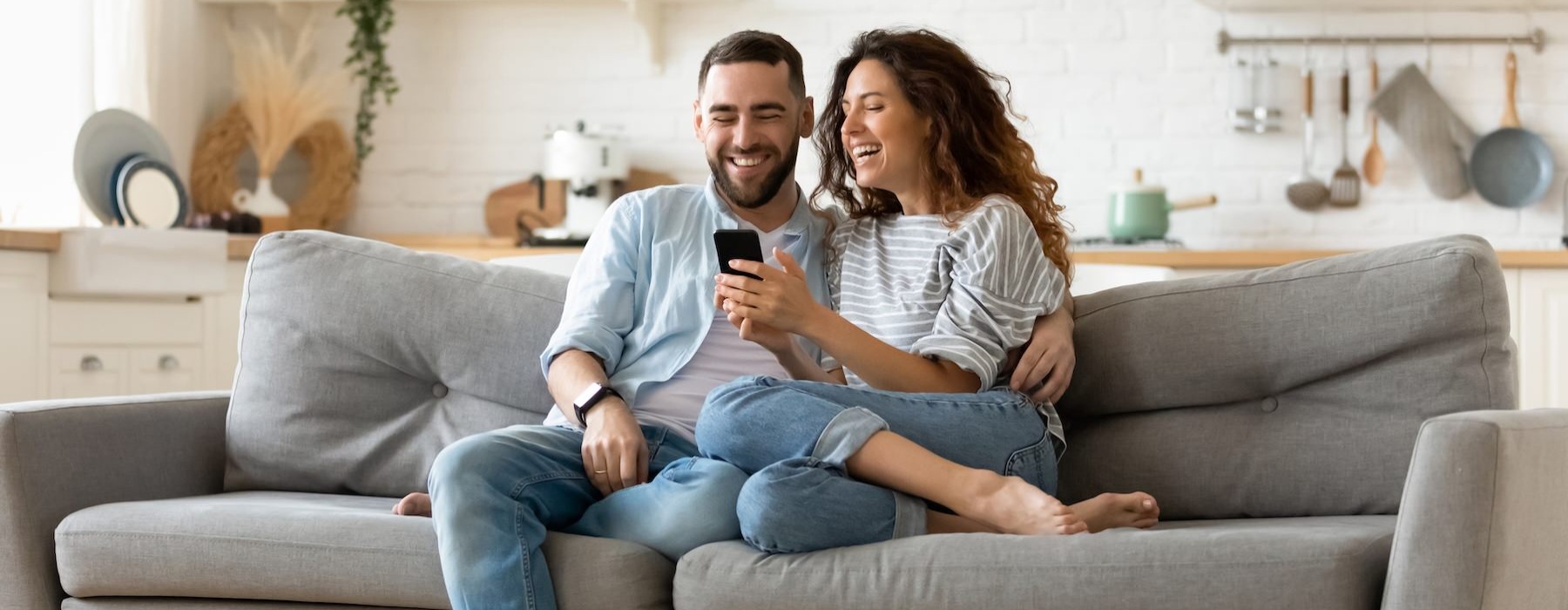 a man and a woman sitting on a couch
