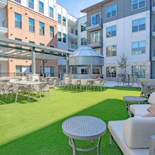 Quick access to state-of-the-art amenities a courtyard with tables and chairs